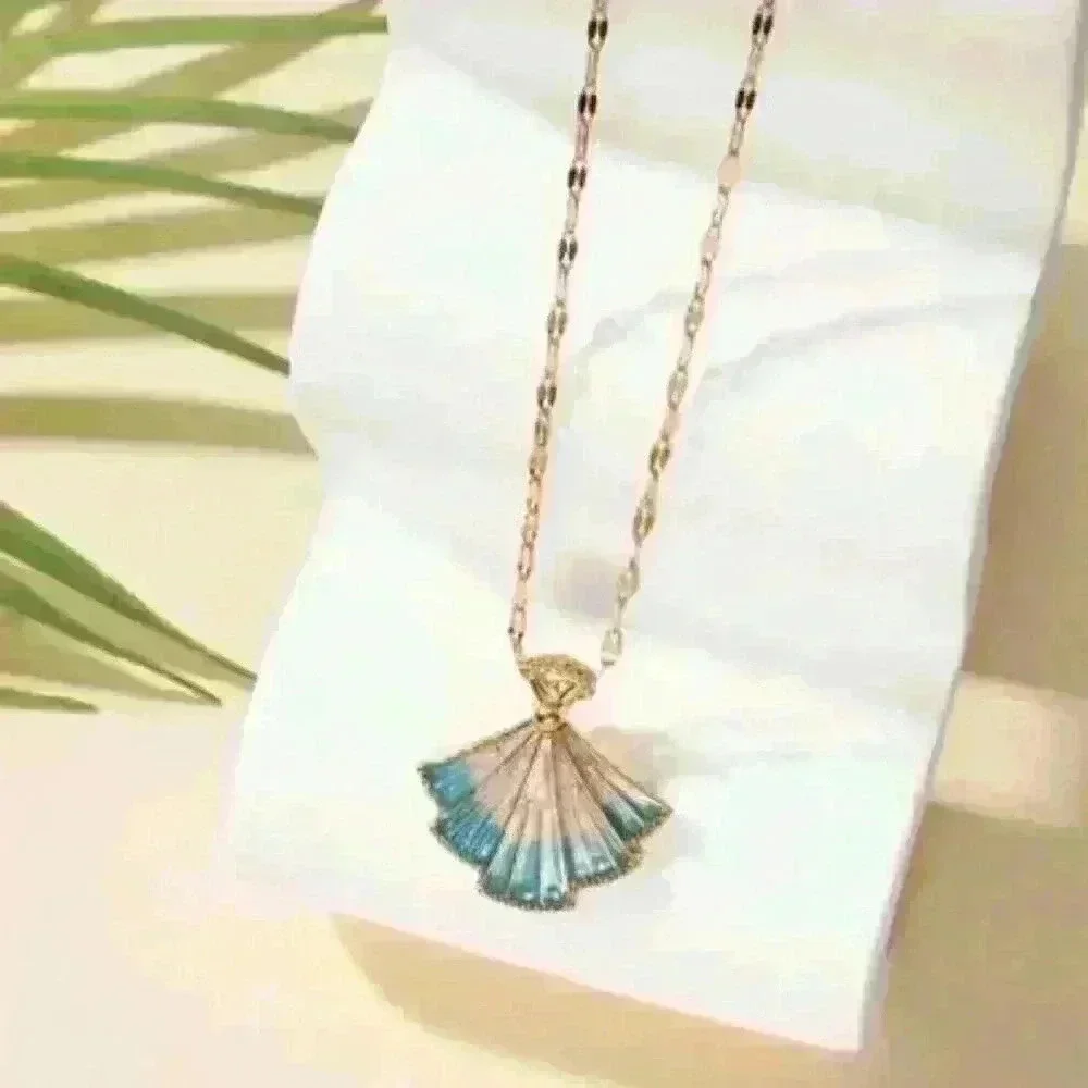 Delicate Fan-Shaped Pendant Accented with Shimmering Blue Hues
